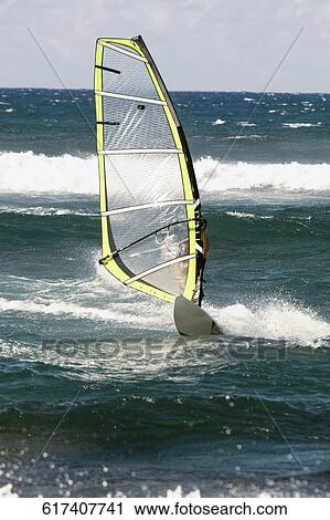 Windsurfer surfing in the sea, Hookipa Beach, Maui, Hawaii, USA View Large Photo Image Stock Image - Windsurfer surfing in the sea, Hookipa Beach, Maui, Hawaii, USA. Fotosearch