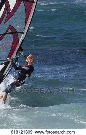 Stock Photo - Windsurfer surfing in the sea, Hookipa Beach, Maui, Hawaii, USA. Fotosearch