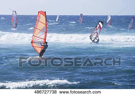 Windsurfers surfing in the sea, Hookipa Beach, Maui, Hawaii, USA View Large Photo Image Stock Photo - Windsurfers surfing in the sea, Hookipa Beach, Maui, Hawaii, USA. Fotosearch