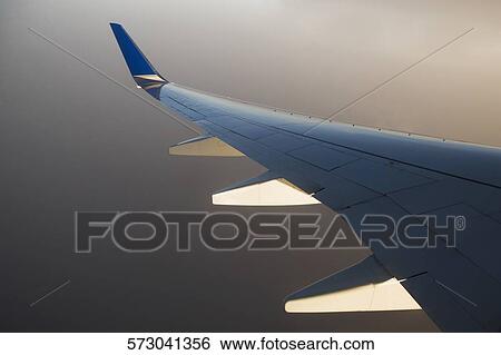 Wing of an airplane View Large Photo Image Stock Photograph - Wing of an airplane. Fotosearch