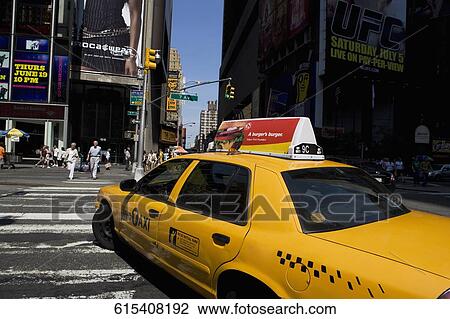 Yellow taxi on the road, Times Square, Manhattan, New York City, New York State, USA View Large Photo Image Stock Image - Yellow taxi on the road, Times Square, Manhattan, New York City, New York State, USA. Fotosearch