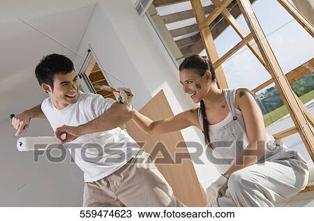 Young couple having fun View Large Photo Image Stock Image - Young couple having fun. Fotosearch