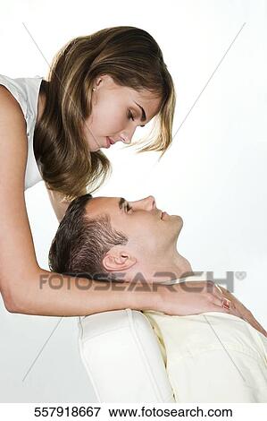 Young couple looking at each other View Large Photo Image Stock Photo - Young couple looking at each other. Fotosearch