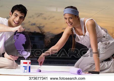 Young couple mixing colors and smiling View Large Photo Image Stock Image - Young couple mixing colors and smiling. Fotosearch