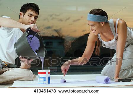 Young couple mixing colors View Large Photo Image Stock Photo - Young couple mixing colors. Fotosearch