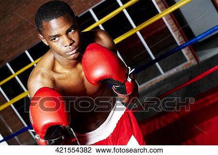 Stock Image - Young male boxer in a fighting stance. Fotosearch