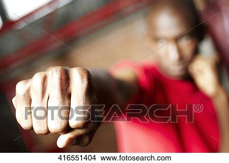 Young man practicing boxing View Large Photo Image Picture - Young man practicing boxing. Fotosearch