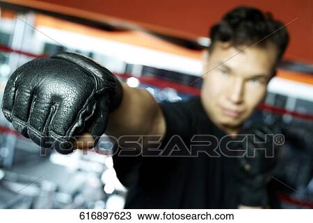 Young man practicing boxing View Large Photo Image Stock Image - Young man practicing boxing. Fotosearch