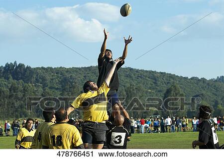 Young men and mid adult men playing rugby View Large Photo Image Stock Image - Young men and mid adult men playing rugby. Fotosearch