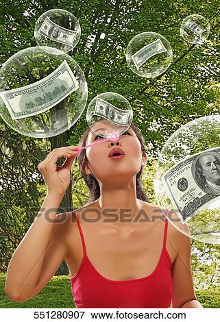 Young woman blowing bubbles View Large Photo Image Stock Photo - Young woman blowing bubbles. Fotosearch