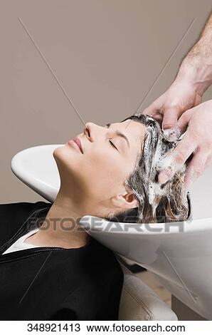 Young woman getting hair shampooed at the hair salon View Large Photo Image Stock Image - Young woman getting hair shampooed at the hair salon. Fotosearch