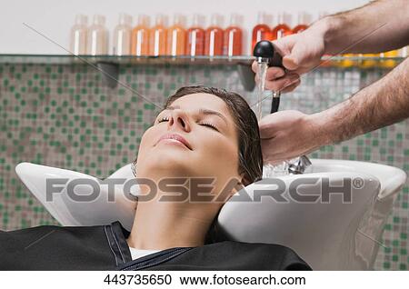 Young woman having hair washed in the hair salon View Large Photo Image Stock Image - Young woman having hair washed in the hair salon. Fotosearch