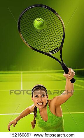 Young woman hitting a tennis ball View Large Photo Image Stock Photo - Young woman hitting a tennis ball. Fotosearch