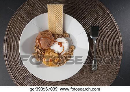 Assorted ice creams scoops garnished with nuts and wafers View Large Photo Image Stock Photo - Assorted ice creams scoops garnished with nuts and wafers. Fotosearch