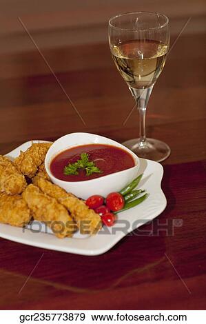 Batter fried chicken with ketchup View Large Photo Image Stock Photo - Batter fried chicken with ketchup. Fotosearch