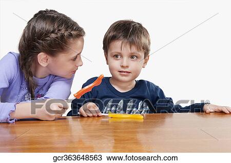 Boy and his sister holding candies View Large Photo Image Stock Image - Boy and his sister holding candies. Fotosearch