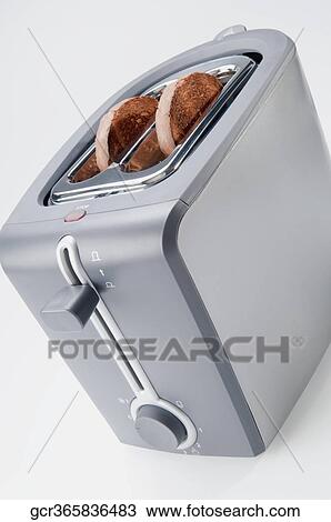 Burnt toasts in a toaster View Large Photo Image Stock Image - Burnt toasts in a toaster. Fotosearch