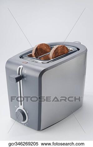 Burnt toasts in a toaster View Large Photo Image Stock Photography - Burnt toasts in a toaster. Fotosearch