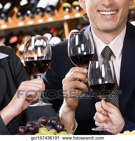Business executives toasting with wine View Large Photo Image Stock Image - Business executives toasting with wine. Fotosearch