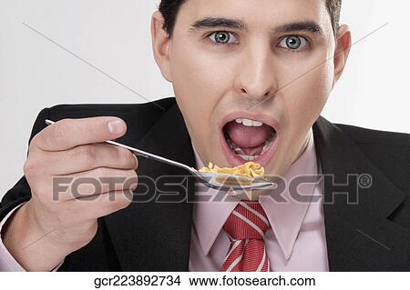 Businessman having breakfast View Large Photo Image Picture - Businessman having breakfast. Fotosearch