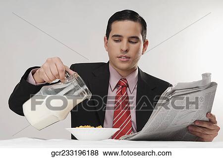 Businessman having breakfast View Large Photo Image Stock Photo - Businessman having breakfast. Fotosearch