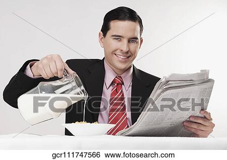 Businessman having breakfast View Large Photo Image Stock Photograph - Businessman having breakfast. Fotosearch