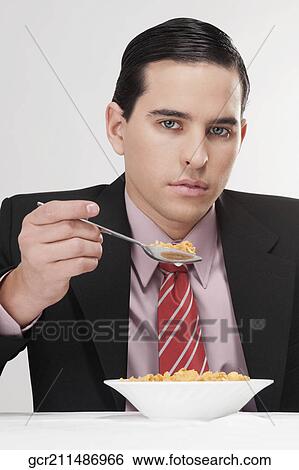 Businessman having breakfast View Large Photo Image Stock Photograph - Businessman having breakfast. Fotosearch
