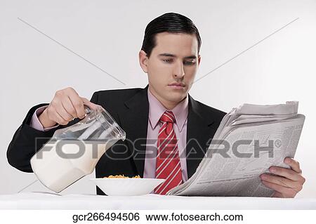Businessman having breakfast View Large Photo Image Stock Photograph - Businessman having breakfast. Fotosearch