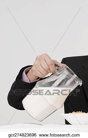 Stock Photograph - Businessman having breakfast. Fotosearch