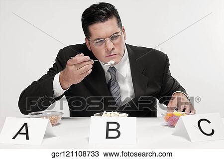 Businessman tasting food samples View Large Photo Image Stock Image - Businessman tasting food samples. Fotosearch