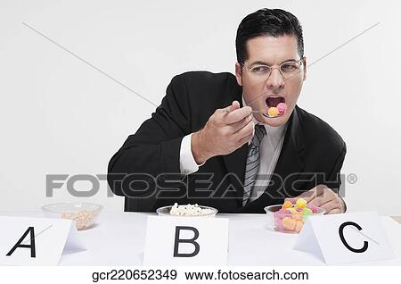 Businessman tasting food samples View Large Photo Image Stock Photo - Businessman tasting food samples. Fotosearch