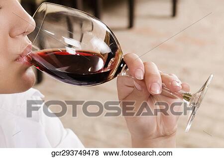 Businesswoman drinking wine View Large Photo Image Stock Photo - Businesswoman drinking wine. Fotosearch