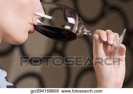 Businesswoman drinking wine View Large Photo Image Stock Photo - Businesswoman drinking wine. Fotosearch