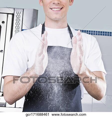Chef dusting hands with flour View Large Photo Image Stock Image - Chef dusting hands with flour. Fotosearch