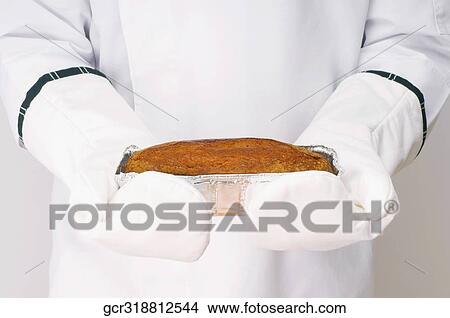 Chef holding a baked cake View Large Photo Image Picture - Chef holding a baked cake. Fotosearch