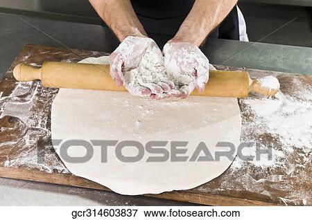 Stock Photo - Chef's hands covered with flour. Fotosearch