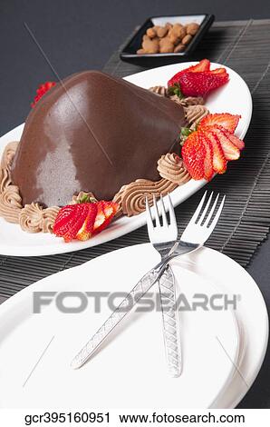 Chocolate dessert served with strawberries View Large Photo Image Stock Image - Chocolate dessert served with strawberries. Fotosearch