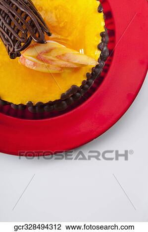 Chocolate garnish on a lemon flan cake View Large Photo Image Stock Image - Chocolate garnish on a lemon flan cake. Fotosearch