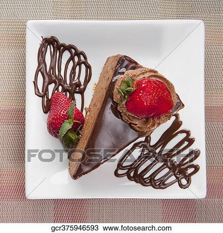 Chocolate mousse cake served with strawberries View Large Photo Image Stock Image - Chocolate mousse cake served with strawberries. Fotosearch