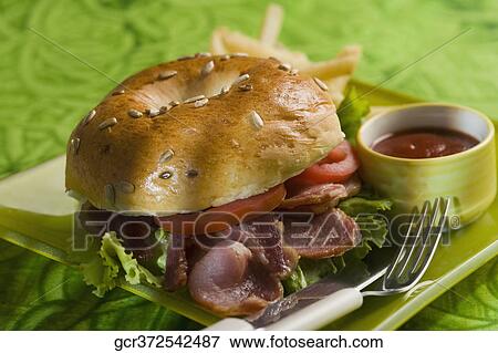 Close-up of a bacon bagel View Large Photo Image Stock Photo - Close-up of a bacon bagel. Fotosearch