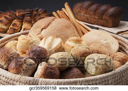 Close-up of a basket of assorted bread rolls and scones View Large Photo Image Stock Photo - Close-up of a basket of assorted bread rolls and scones. Fotosearch