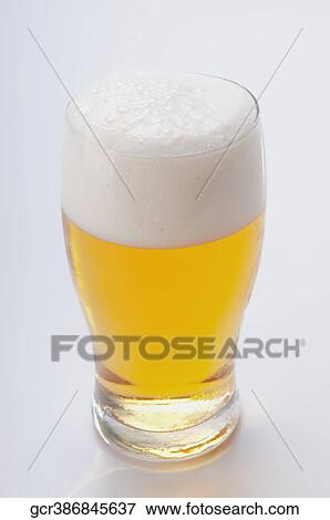 Close-up of a beer glass View Large Photo Image Stock Photo - Close-up of a beer glass. Fotosearch