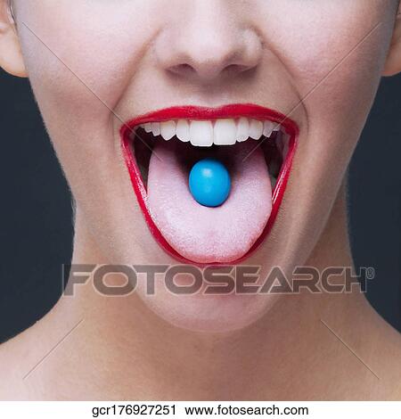 Close-up of a blue candy on a woman's tongue View Large Photo Image Stock Image - Close-up of a blue candy on a woman's tongue. Fotosearch