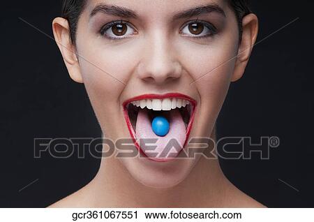 Close-up of a blue candy on a woman's tongue View Large Photo Image Stock Image - Close-up of a blue candy on a woman's tongue. Fotosearch