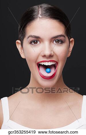 Close-up of a blue candy on a woman's tongue View Large Photo Image Stock Photo - Close-up of a blue candy on a woman's tongue. Fotosearch