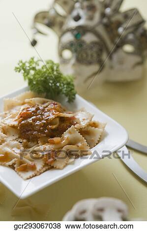 Close-up of a bowl of bow tie pasta with mushrooms View Large Photo Image Stock Photo - Close-up of a bowl of bow tie pasta with mushrooms. Fotosearch