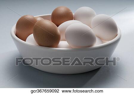 Close-up of a bowl of brown and white eggs View Large Photo Image Stock Image - Close-up of a bowl of brown and white eggs. Fotosearch