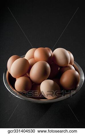 Close-up of a bowl of brown eggs View Large Photo Image Stock Image - Close-up of a bowl of brown eggs. Fotosearch