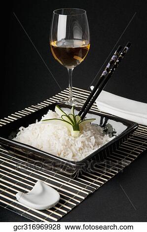 Close-up of a bowl of cooked white rice served with wine View Large Photo Image Stock Photo - Close-up of a bowl of cooked white rice served with wine. Fotosearch