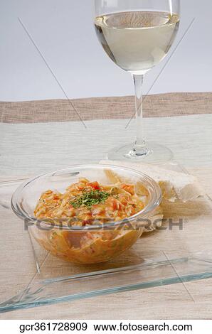 Stock Photo - Close-up of a bowl of pasta with white wine. Fotosearch